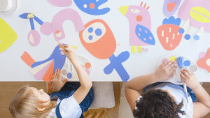 above shot of two young girls painting