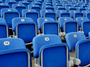 row of blue empty stadium seats